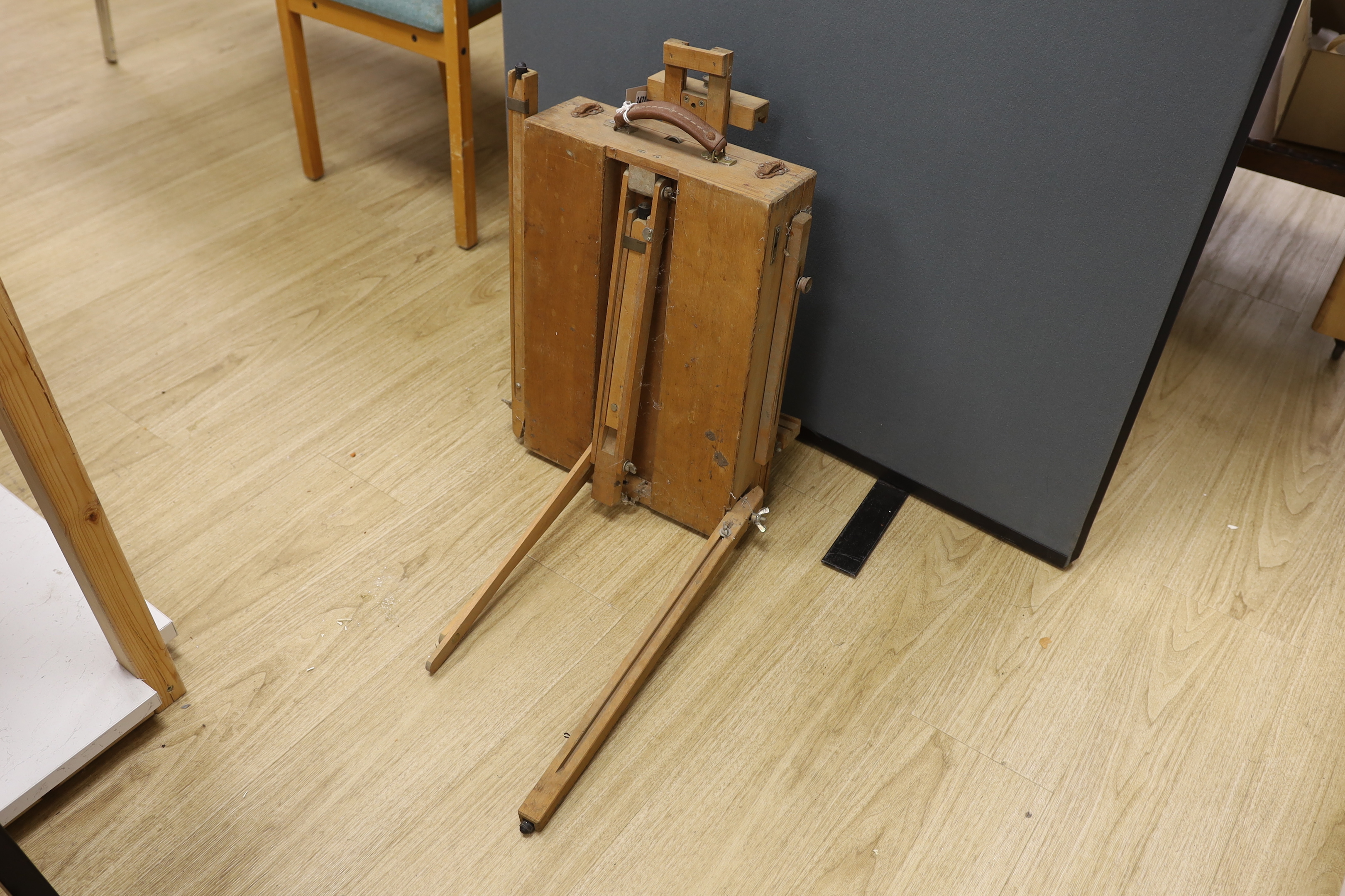A travelling easel stamped ‘M abef made in Italy’
